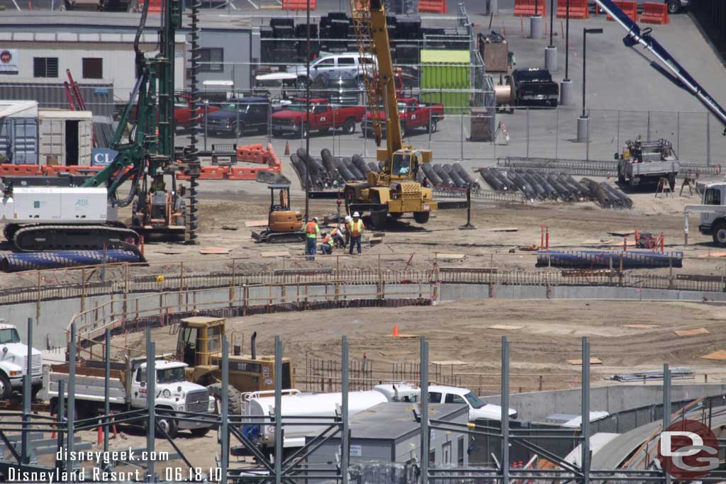 Looks like the holes are still being drilled for the footers for the rock/steel work on the far side of cars land.