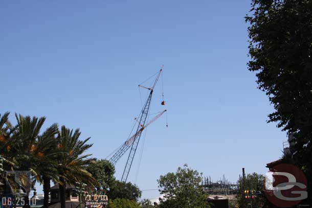 Noticed some workers in a bucket hanging from one of the cranes