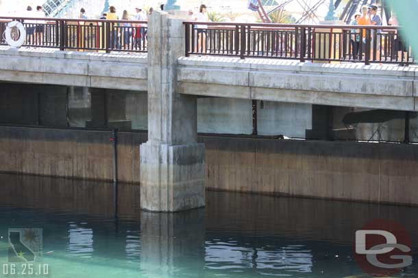 Anyone know why there is a barrier left up under the bridge?  Is it to block the view of the World of Color or is it for a reason (one thought I had was because of the amount of low level lasers this could act as a backstop possibly.. did not pay attention during the show though to see if that theory had any merit).