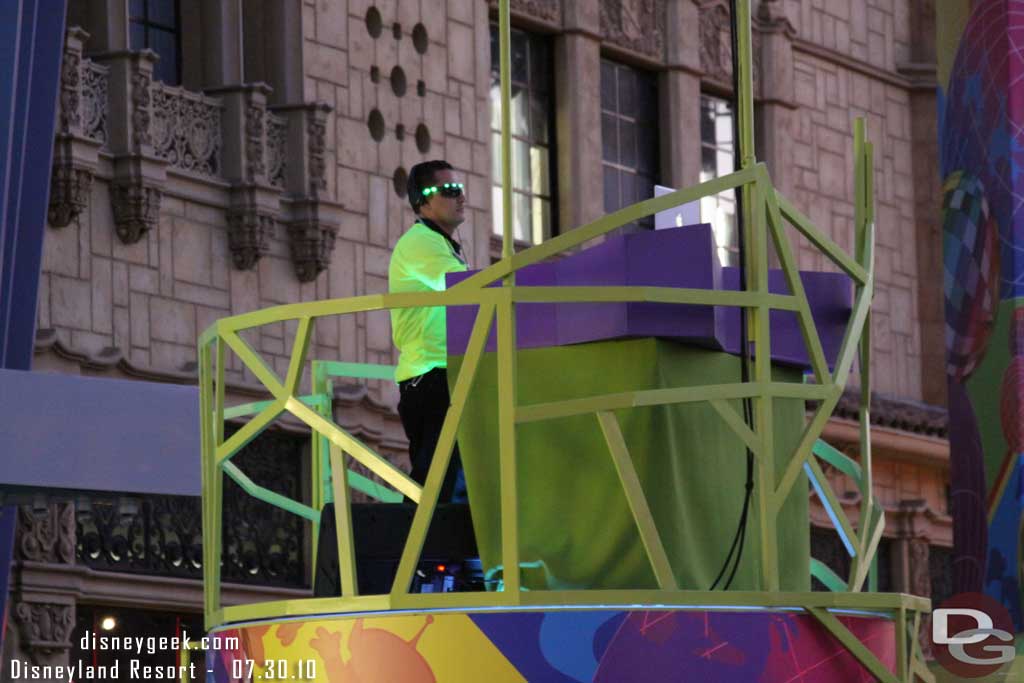 A DJ getting set up for the evening (explains the laptop)