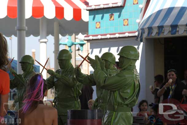 Green Army men out entertaining the crowd.