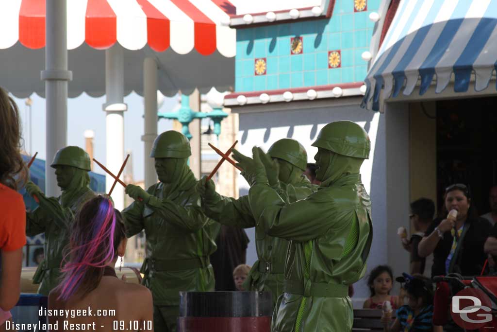 Green Army men out entertaining the crowd.