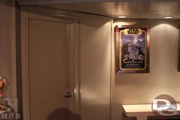 A plain wall/door blocking the exit to Star Tours.