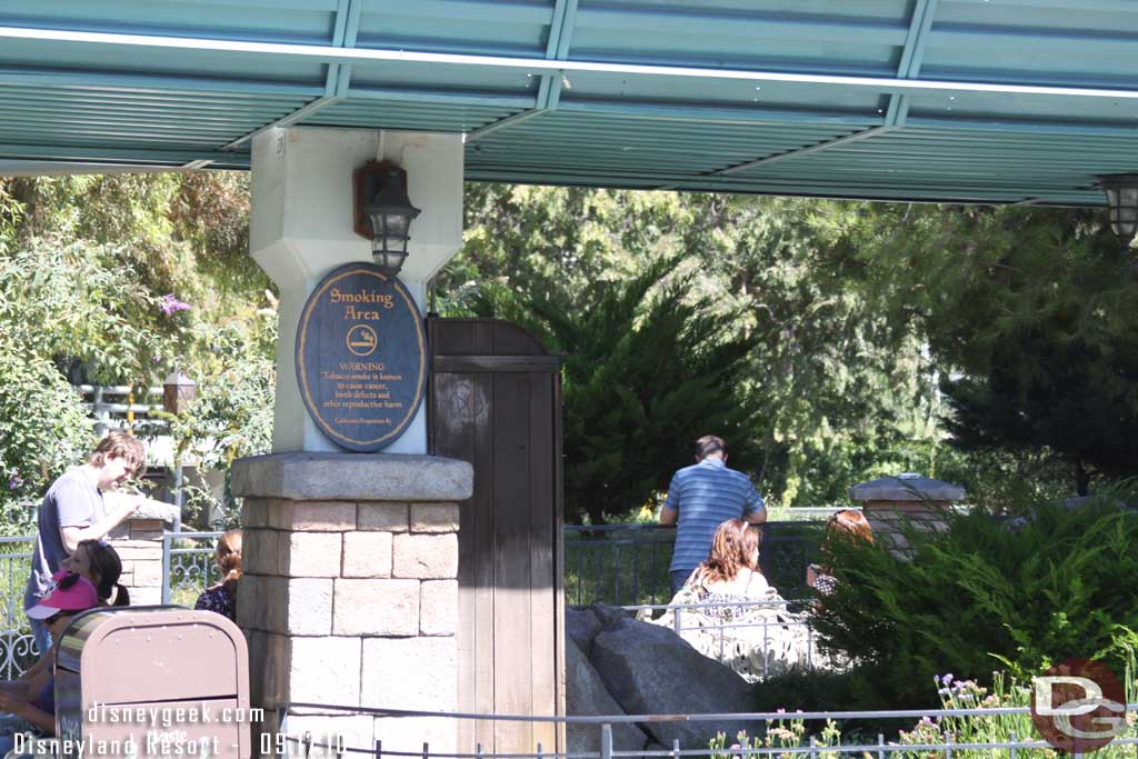 The smoking area is back here now, across from the Matterhron by the Autopia.