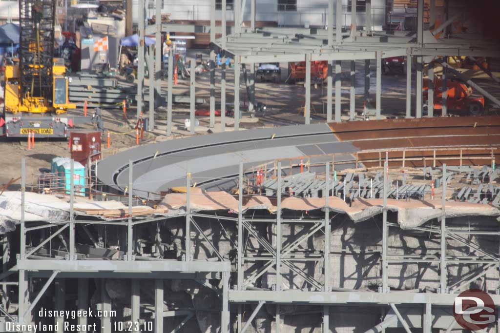 Looks like the rockwork on the other side is starting to be painted, notice the rust color at the top of the concrete in the foreground.