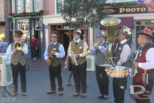 A band out entertaining the long corn dog line.