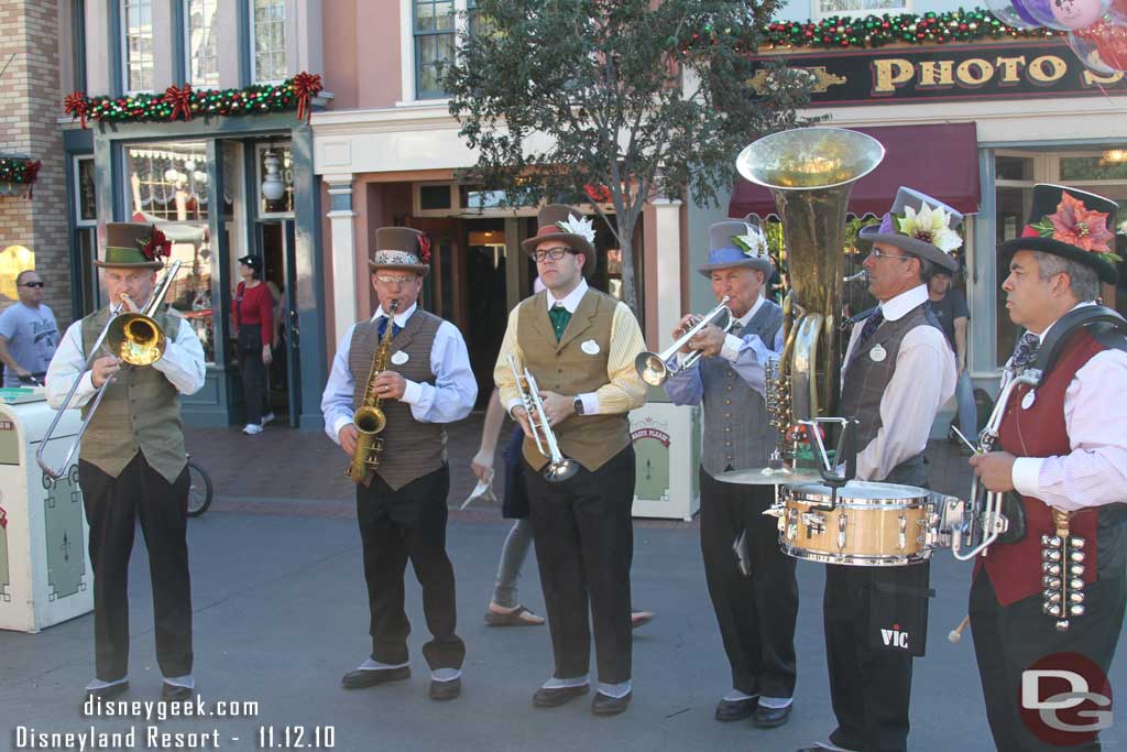 A band out entertaining the long corn dog line.