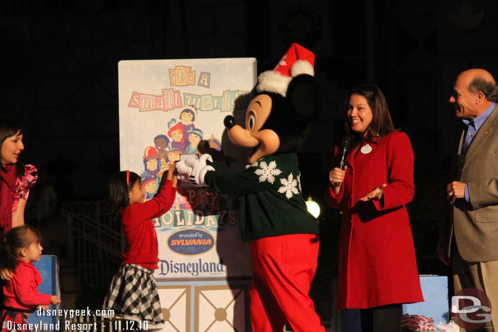 Adela and Mickey Mouse flipped the switch to turn on the lights.