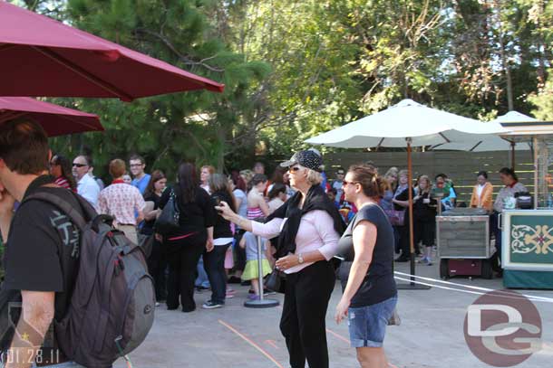 The line was wrapped around and back toward the gate near the train tracks.