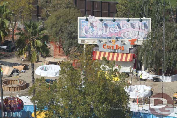 Looks like the concrete planters have been poured near the Corn Dog stand.