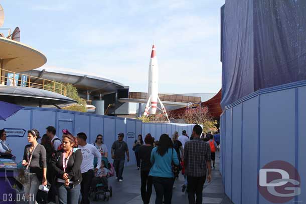 Tomorrowland has quite a few walls up now as the paving project is continuing on the left and painting on the right.