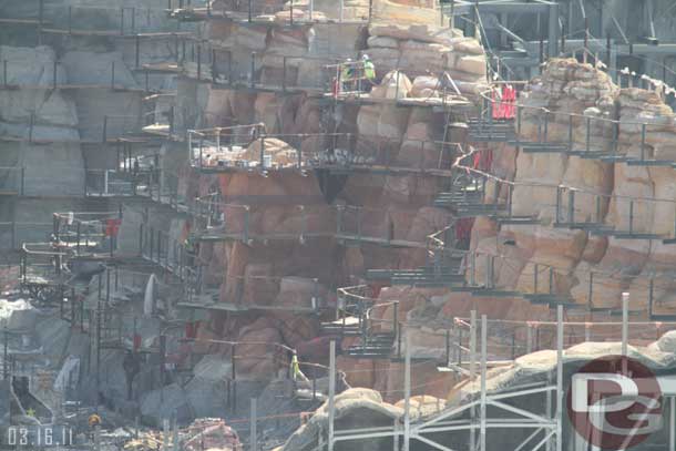 Looks like the scaffolding on the right in this shot is being taken apart?  The boards they were walking on appear to be gone.