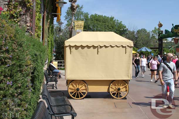 The merchandise cart is across the walkway.