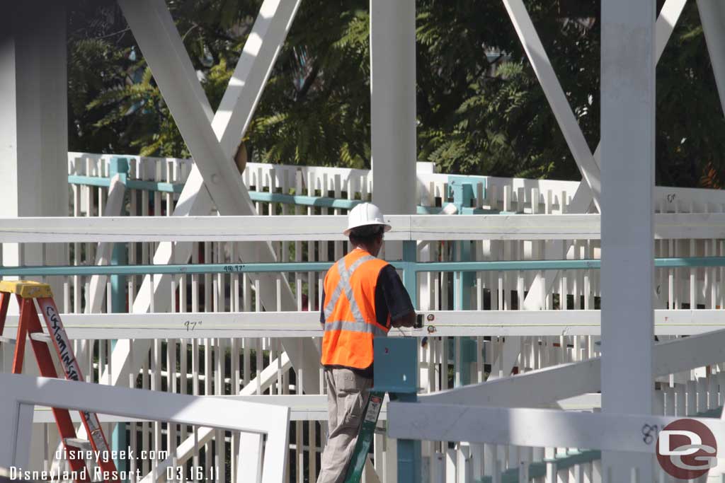 Work on the park.  They are installing some rails around the outside, guessing to support some fencing, signs or plants?