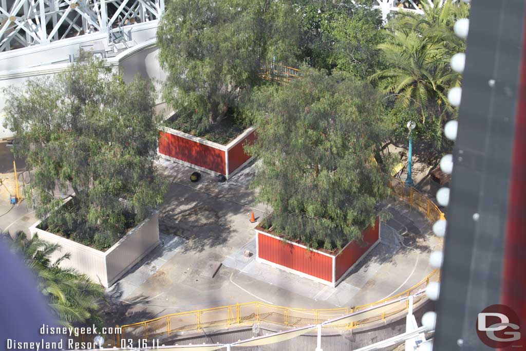 They are painting the planter boxes.