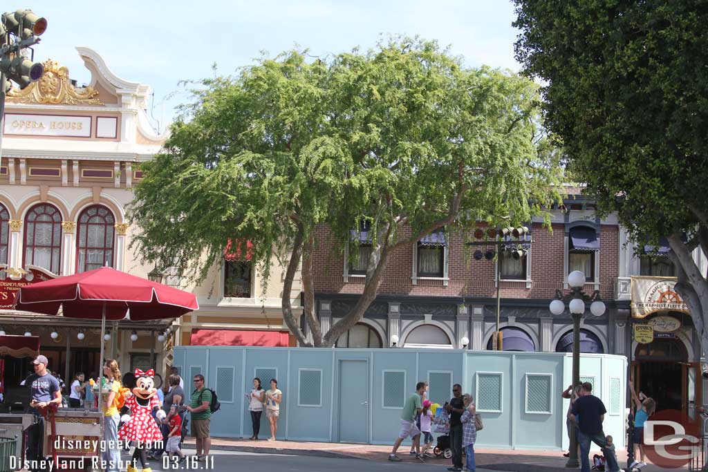 The walls are still up around the trees near the Opera House (also notice Minnie out for a walk)