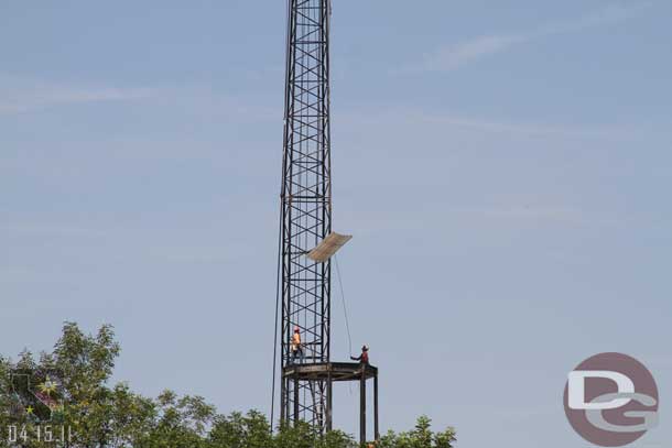 Lowering a floor panel into place on the newly extended tower.