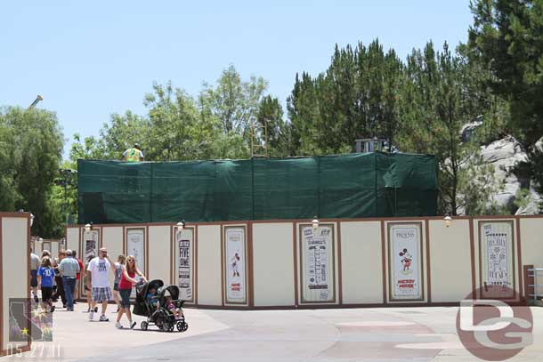 Scaffolding and tarps up around the pump house.  Also could make out some framing behind.