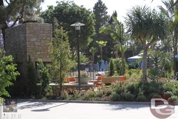 A new outdoor seating area with a large fireplace.