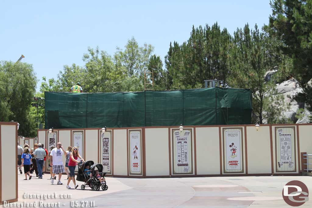 Scaffolding and tarps up around the pump house.  Also could make out some framing behind.