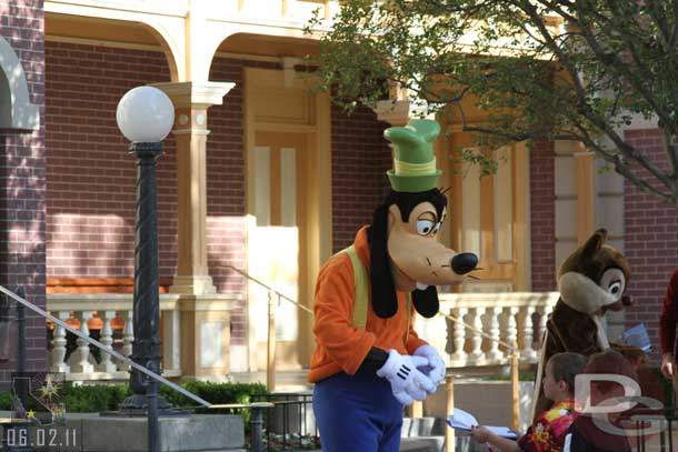 Characters out greetings guests as they enter the park.