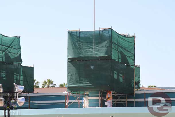 Painters working on one of the fins.