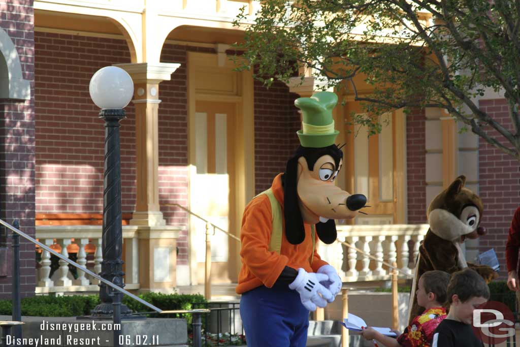 Characters out greetings guests as they enter the park.