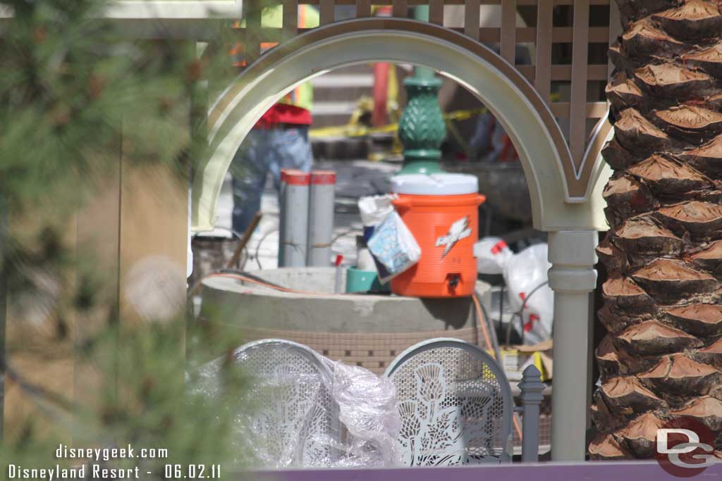 A closer look through one of the arches at the seating area beyond and the metal work on the gates.