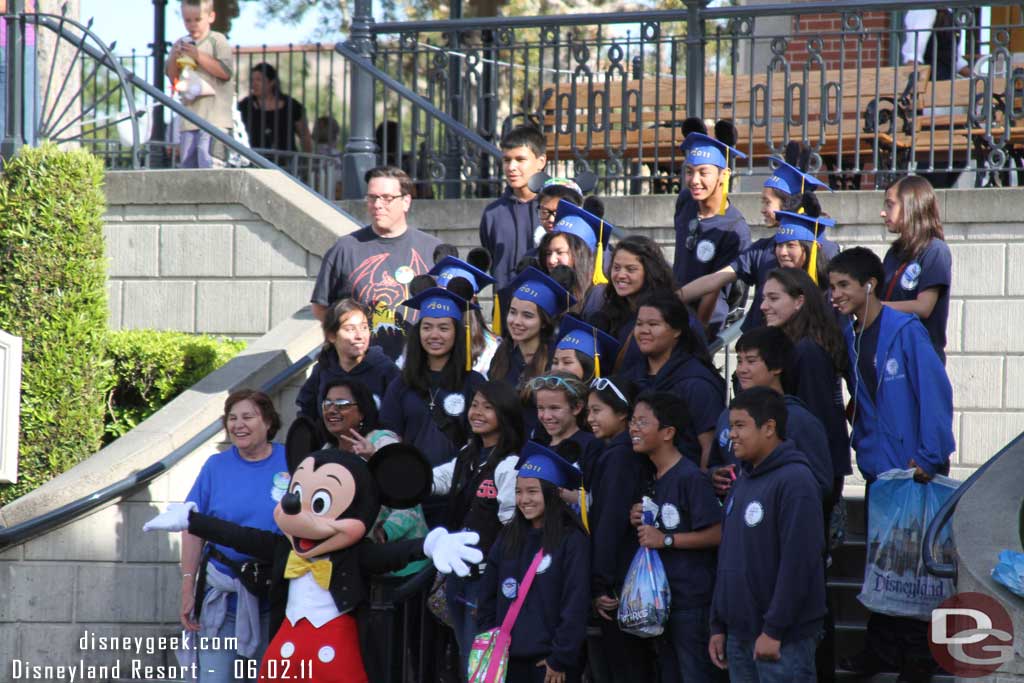 This was interesting.  We were walking through Town Square and heard a bunch of people yelling.  Seems this group was setting up for a picture and Mickey came out and was heading toward the flag pole area.  They were loud enough to draw his attention and he ran across the street for a quick picture with them.  Great moment!