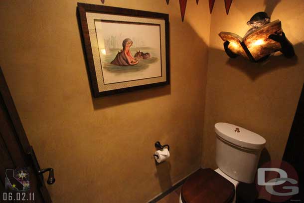 Notice the light fixture above the toilet.