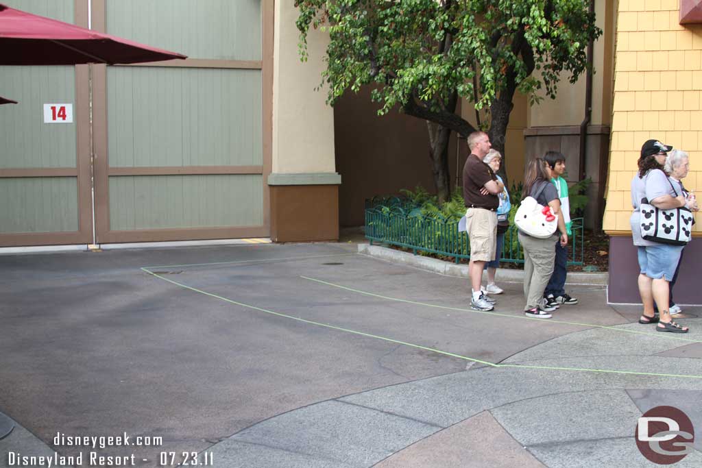 Some tape markings on the ground to guide the line around.