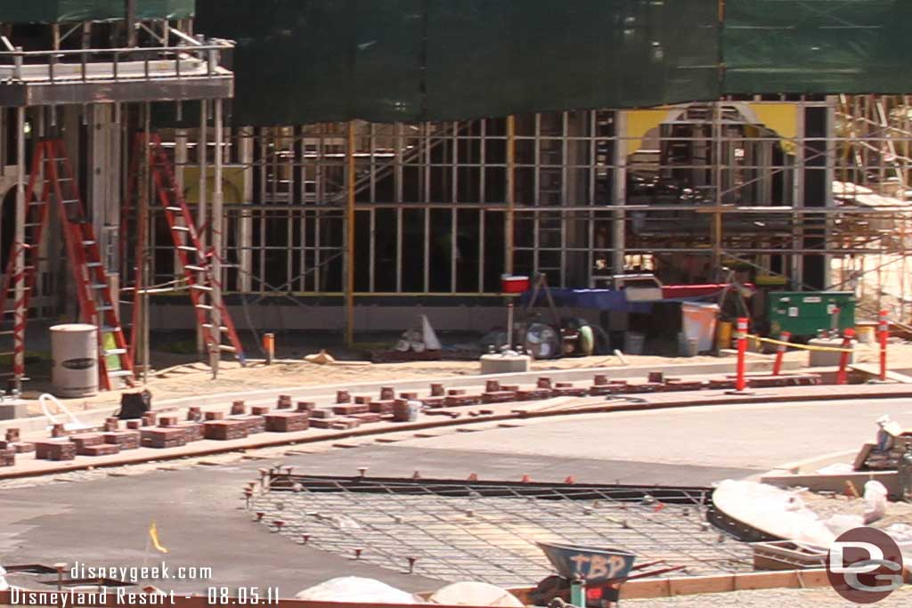 A closer look you can see the rebar for the concrete work around the fountain.  As well as the bricks near the red car track. 