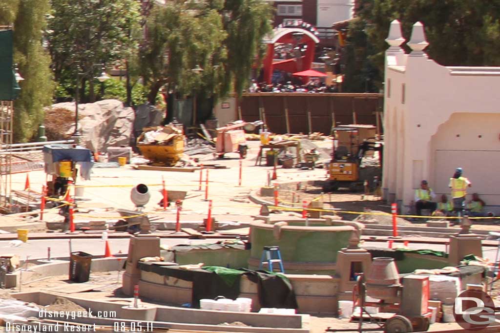 Here you can see the new fountain in the foreground, its pump house off to the right, and a look down the parade route that looks to have been re-poured already.