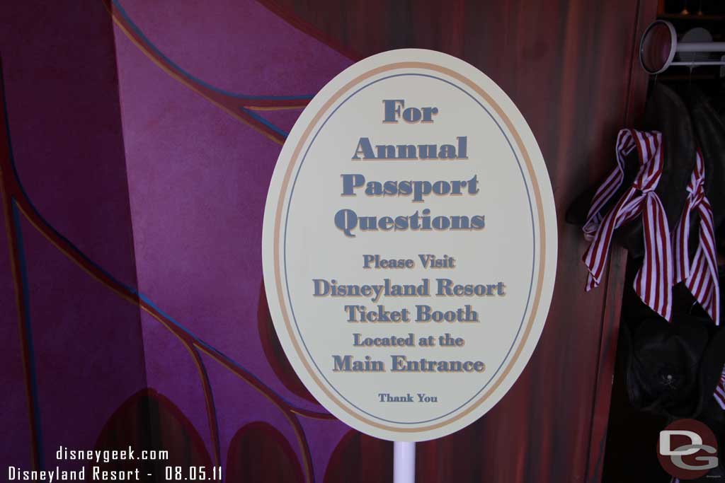 The AP centers at both parks are now closed.  You can get your pass at the ticket booth and your photo taken by any Photopass CM or you can submit online from home.