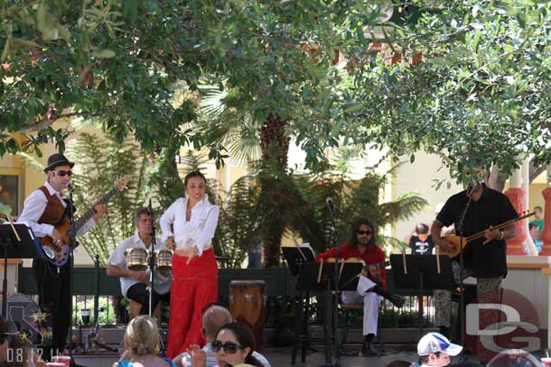 A group performing on the Paradise Gardens stage.