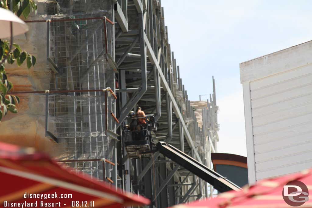 From ground level you can see where they are working on the back of the rocks.  Also in the foreground noted they still have not painted the extension on the facade.