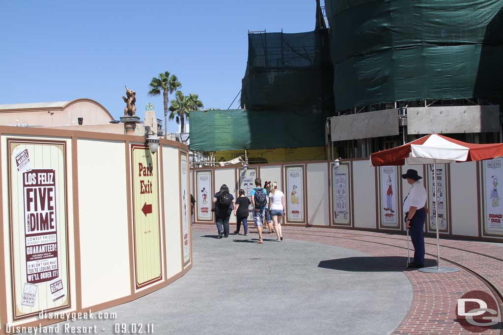 This parth continues around the fountain to the left and curves out to the Backlot.