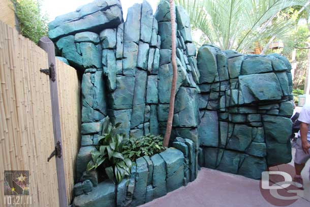 Over in Adventureland the restroom work is done.  The rocks seem much more green now.