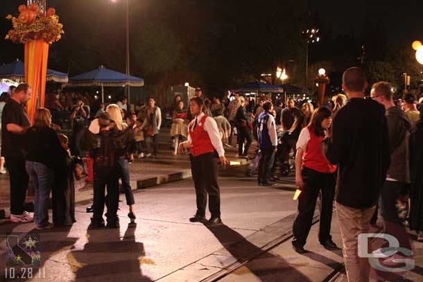 A line of Cast members across Main Street starting to allow only Party guests into the hub area.