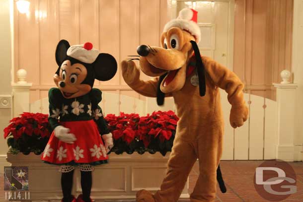 Pluto and Minnie greeting guests.