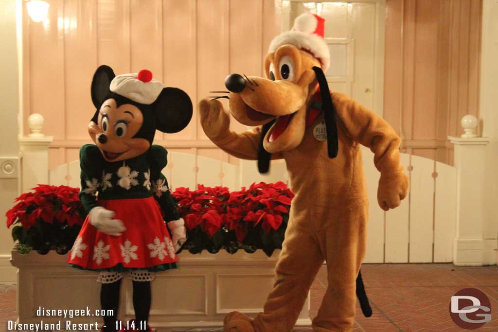 Pluto and Minnie greeting guests.