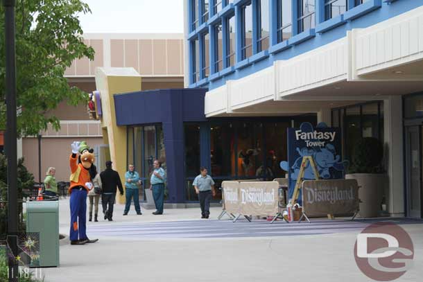 Goofy waving goodbye, also this helps to show where the Fantasy Tower sign is.