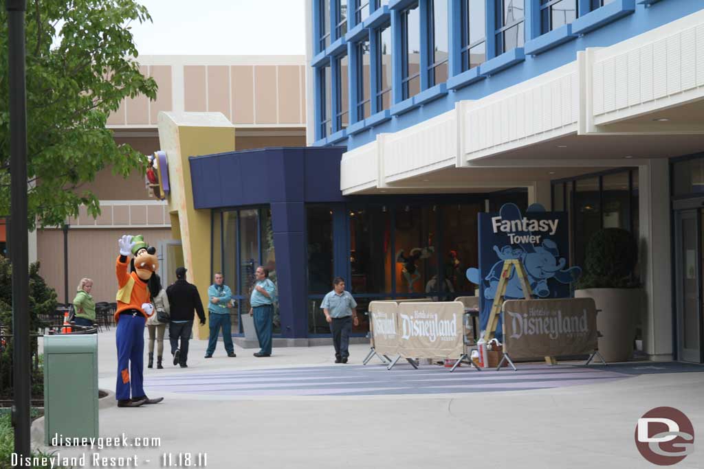 Goofy waving goodbye, also this helps to show where the Fantasy Tower sign is.