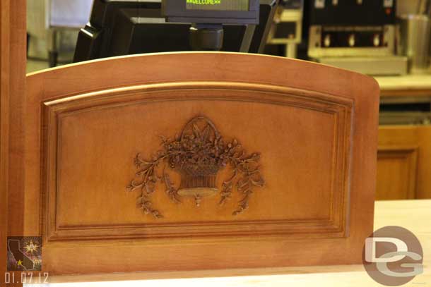 The woodwork by the cash registers.