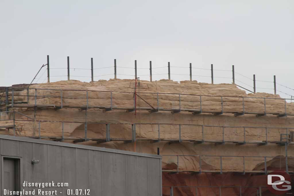 The painting is moving slowly on the rock face that overlooks the Pier.