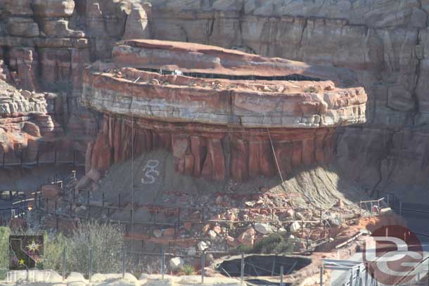 The scaffolding on the radiator cap base is slowly being removed.