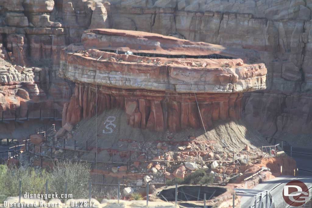 The scaffolding on the radiator cap base is slowly being removed.