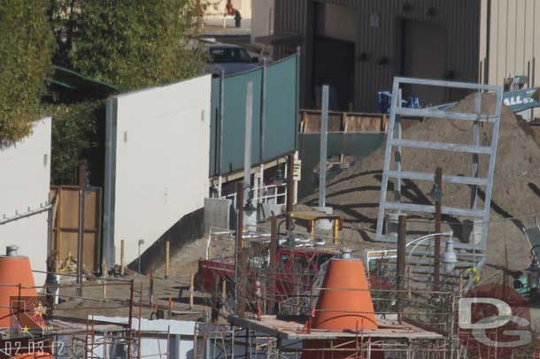 Looks like the frame for a backstage gate being assembled behind the cones.  Also looks like one of the Red Car garage doors is open.