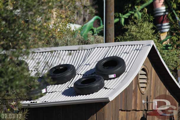 Tires on the roof of the shack now.