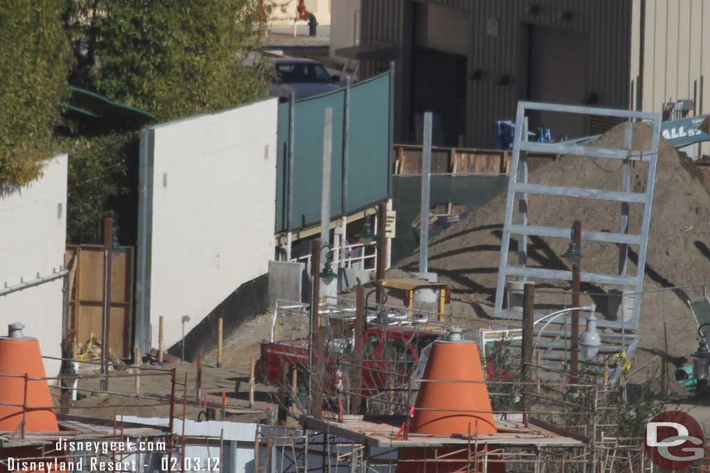 Looks like the frame for a backstage gate being assembled behind the cones.  Also looks like one of the Red Car garage doors is open.